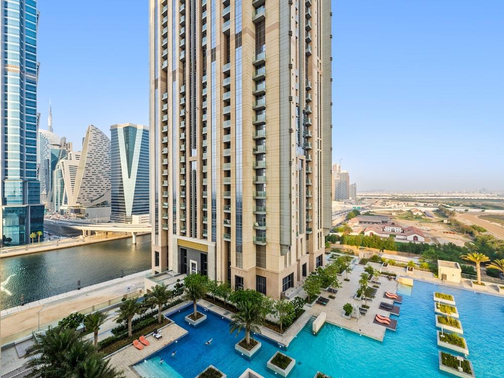 Modern Apartment With Partial Canal and Pool View Exterior