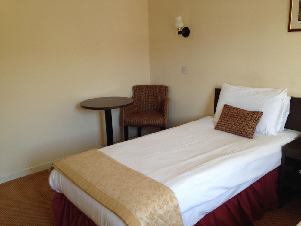 هايلاندر هوتل غرفة