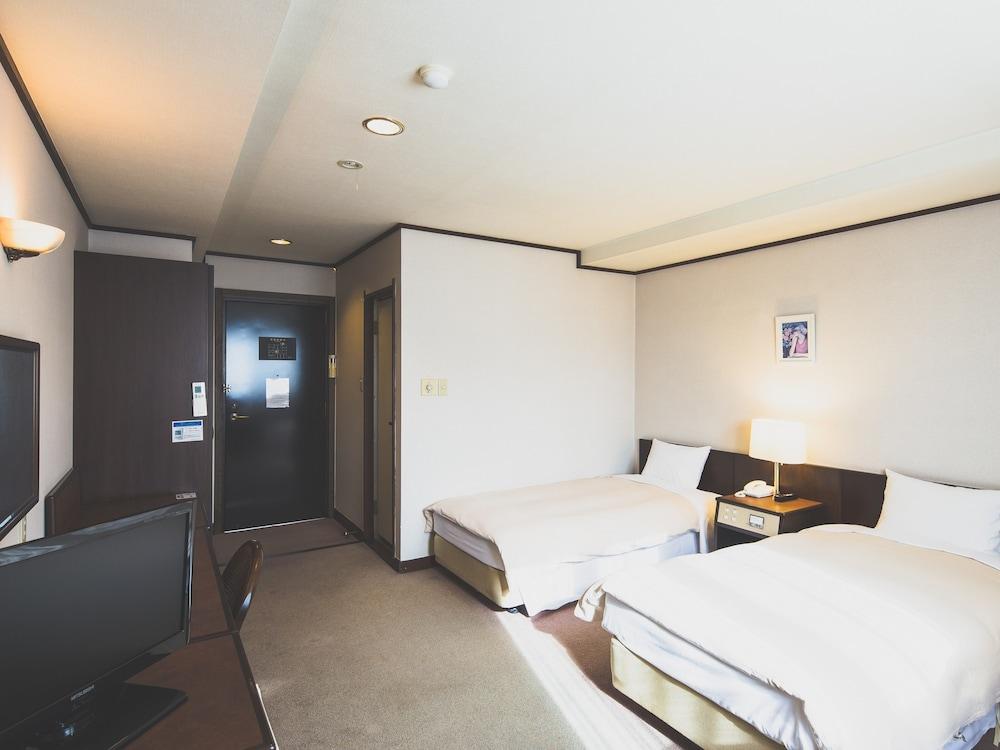 هوتل كارويزاوا إليجانس غرفة