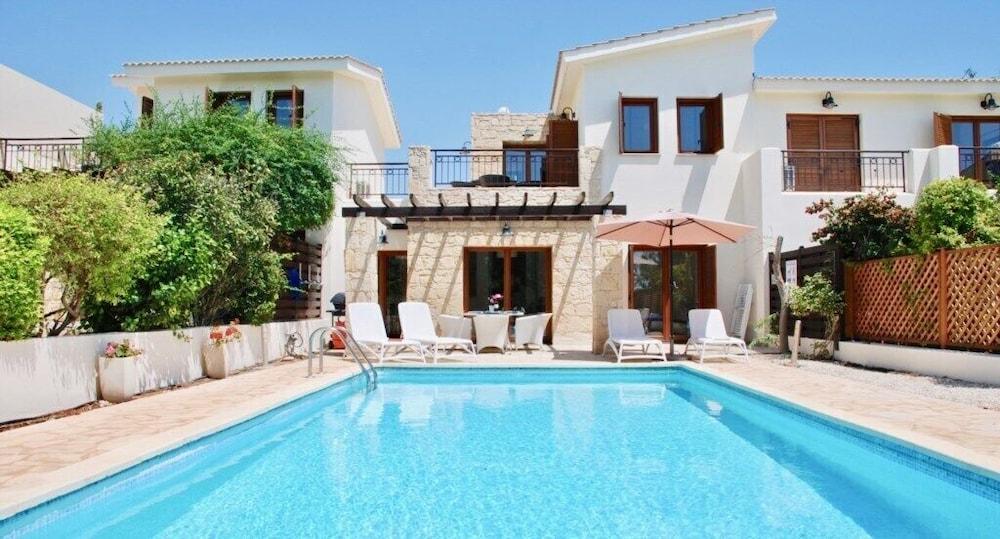 Beautiful 2 Bedroom Villa Proteus HG29 with private pool and pretty golf course views, Short walk to resort village square on Aphrodite Hills Waterslide